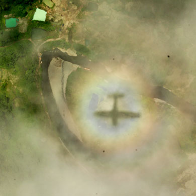 Sombra de la avioneta sobre las nubes